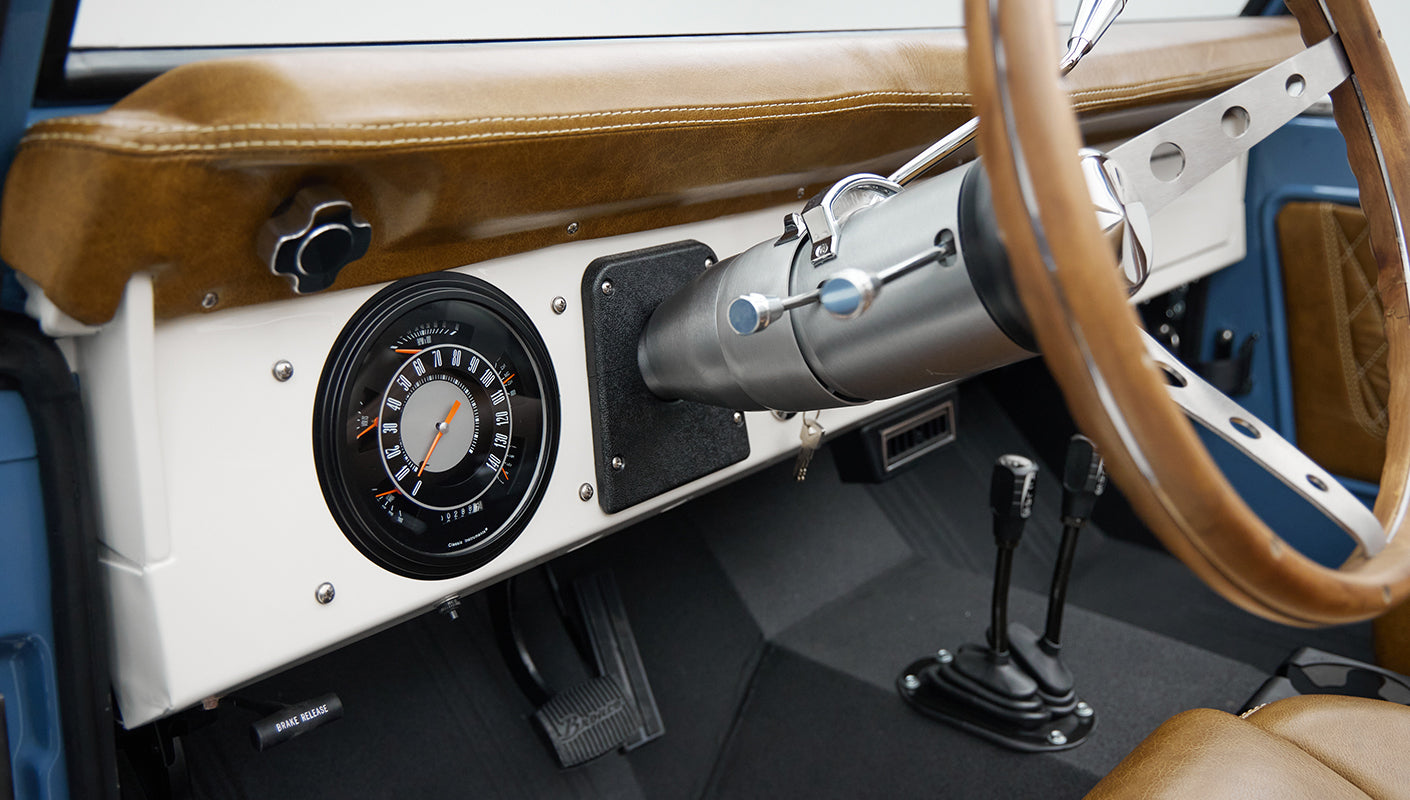 1974 classic ford bronco in stars & stripes blue with whiskey leather driver dash