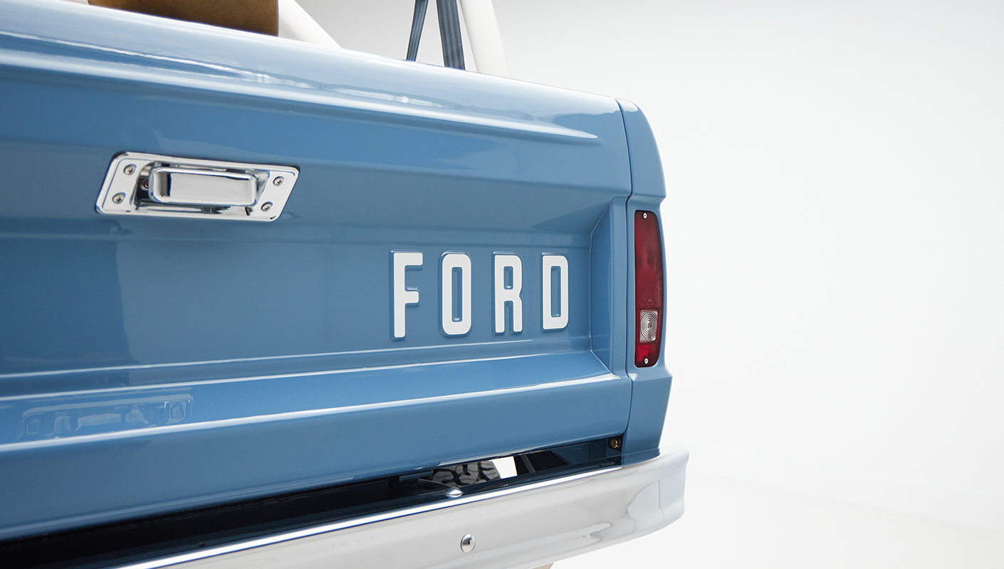 1974 classic ford bronco in stars & stripes blue with whiskey leather logo