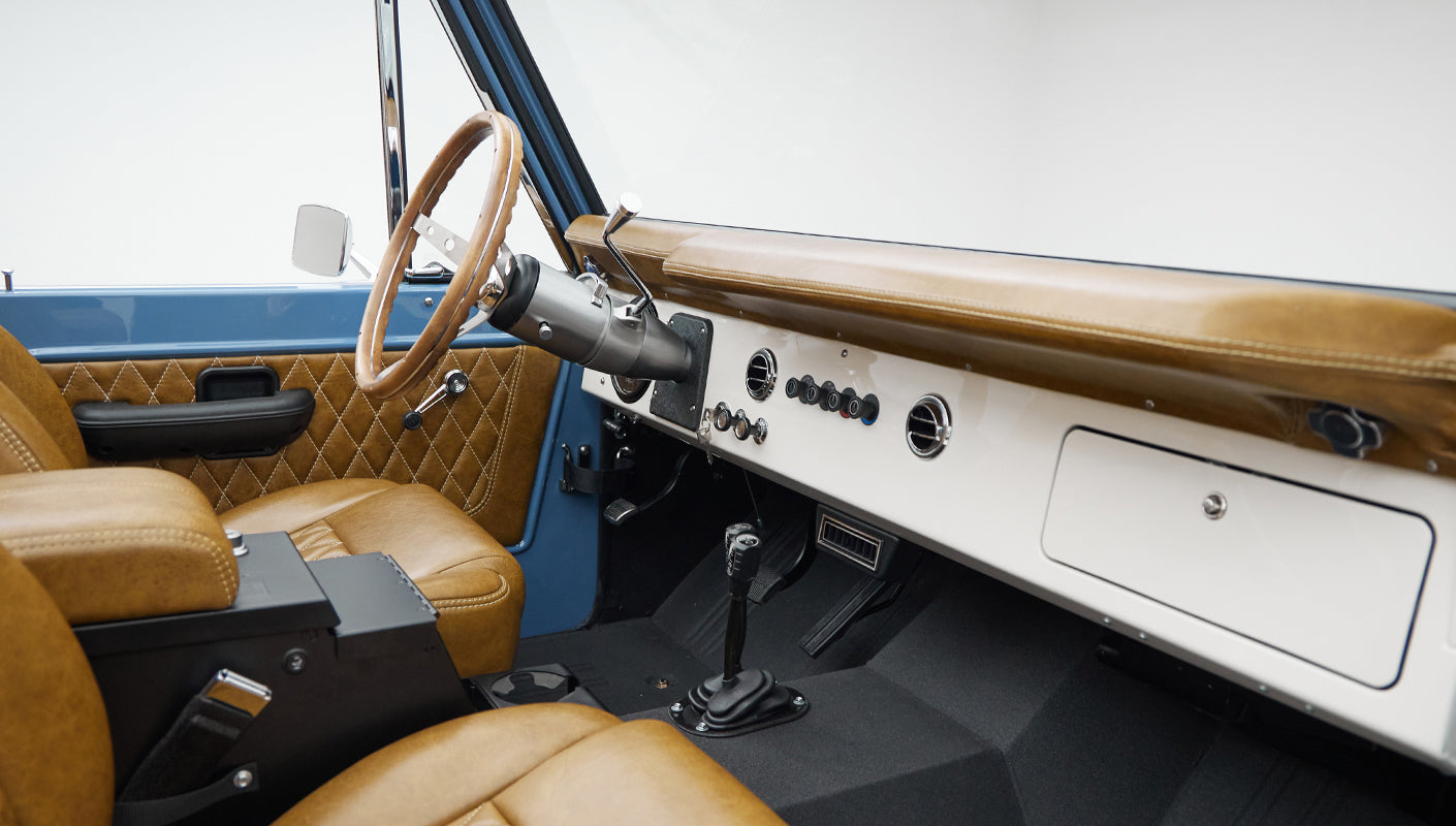 1974 classic ford bronco in stars & stripes blue with whiskey leather passenger dash