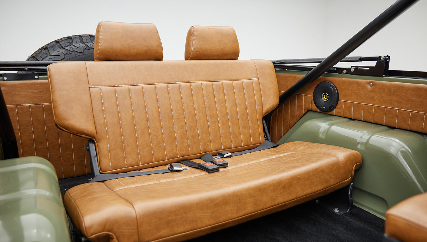 1976 classic ford bronco in boxwood green with ball glove leather rear angle