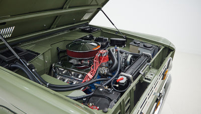 1976 classic ford bronco in boxwood green with ball glove leather motor angle