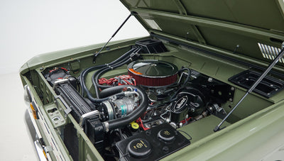 1976 classic ford bronco in boxwood green with ball glove leather motor angle