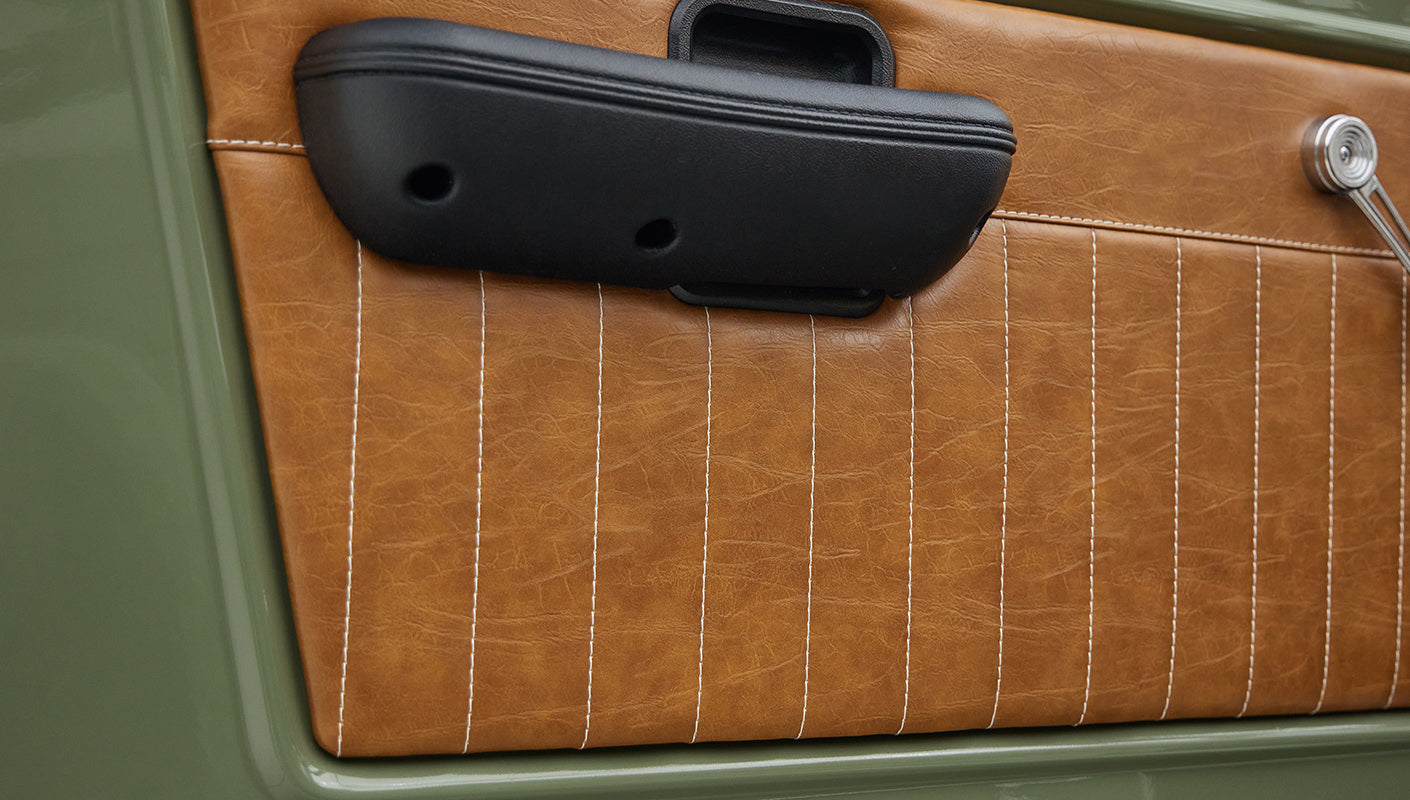 1976 classic ford bronco in boxwood green with ball glove leather door panel