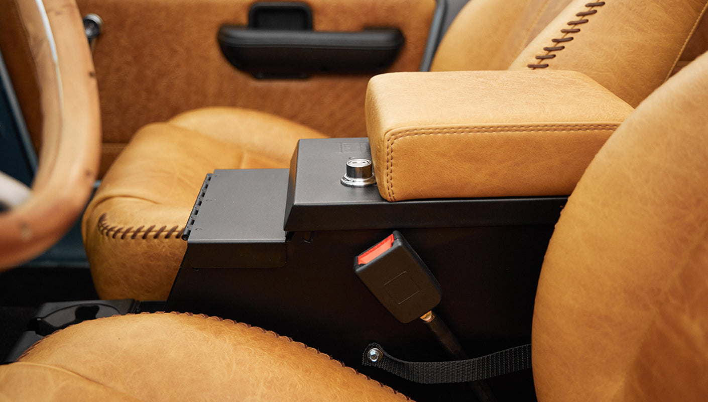 1975 ford bronco painted brittany blue with cowboy debossed, baseball stitch leather console