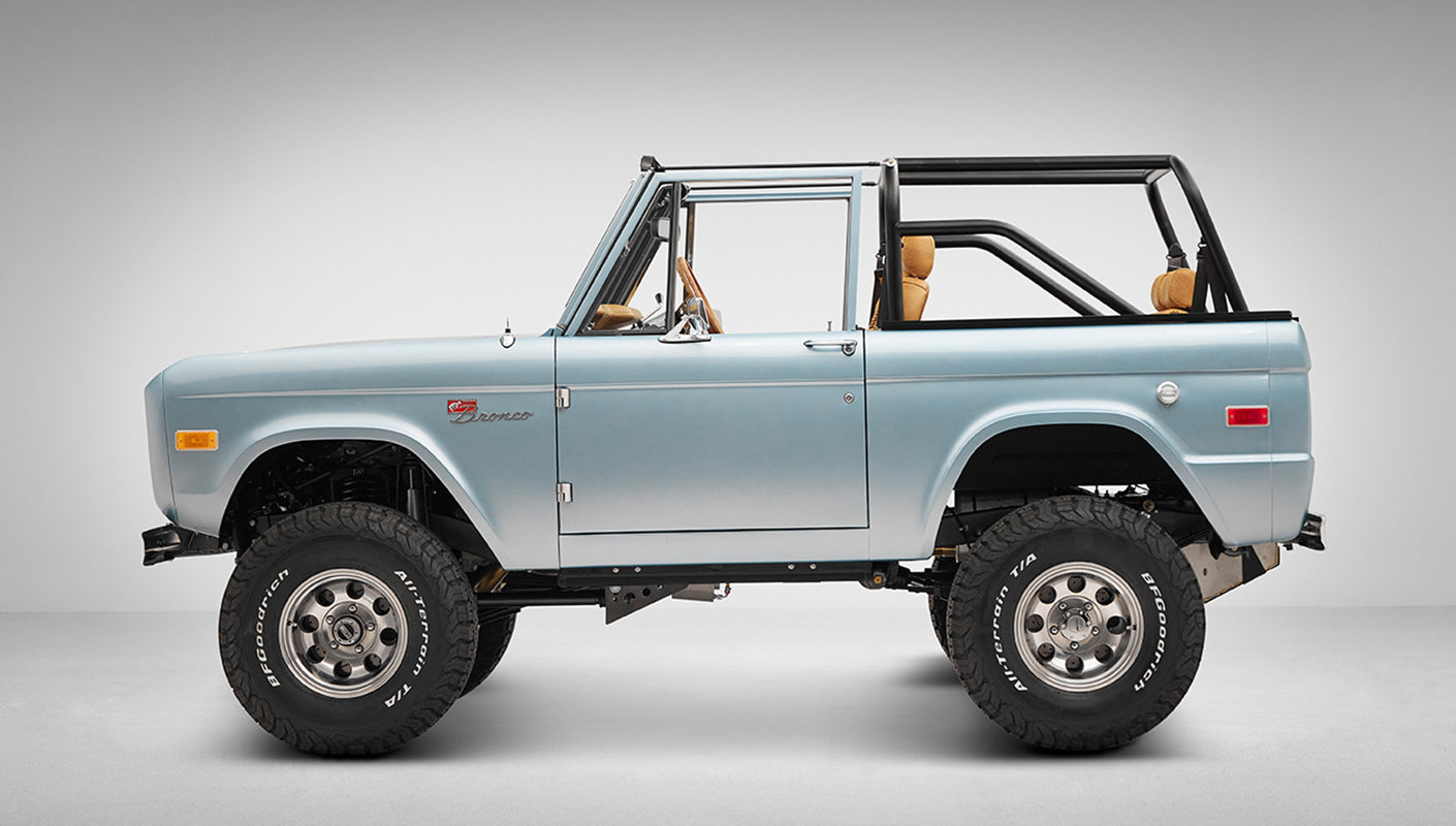 1975 ford bronco painted brittany blue with cowboy debossed, baseball stitch leather driver profile