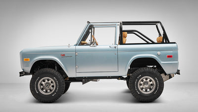 1975 ford bronco painted brittany blue with cowboy debossed, baseball stitch leather driver profile