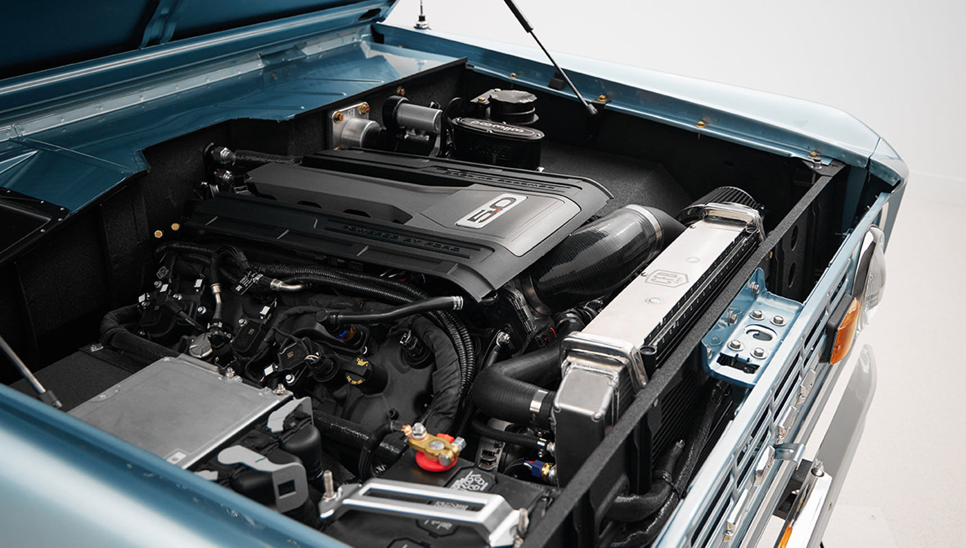 1975 ford bronco painted brittany blue with 3rd gen ford racing coyote motor