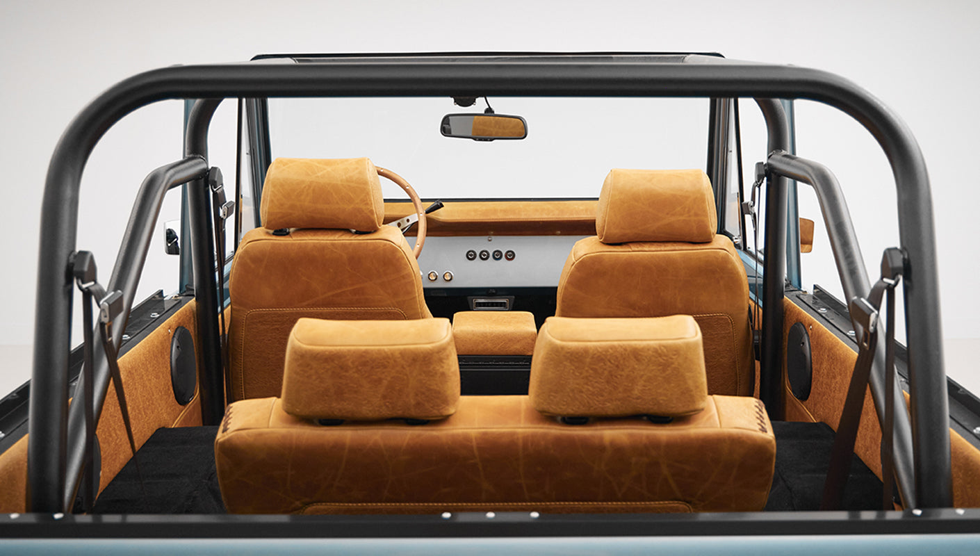 1975 ford bronco painted brittany blue with cowboy debossed, baseball stitch leather interior seats