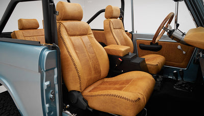 1975 ford bronco painted brittany blue with cowboy debossed, baseball stitch leather passenger seat