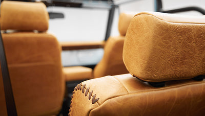 1975 ford bronco painted brittany blue with cowboy debossed, baseball stitch leather headrest