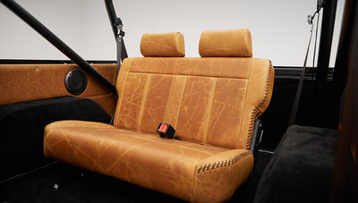 1975 ford bronco painted brittany blue with cowboy debossed, baseball stitch leather rear seat