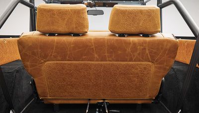 1975 ford bronco painted brittany blue with cowboy debossed, baseball stitch leather passenger seat