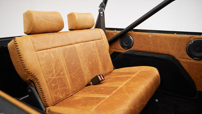 1975 ford bronco painted brittany blue with cowboy debossed, baseball stitch leather rear seat