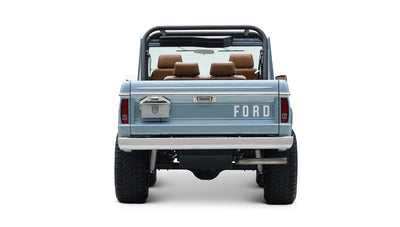 Rear view of Classic Ford Bronco in light blue with visible tailgate and spare tire mount