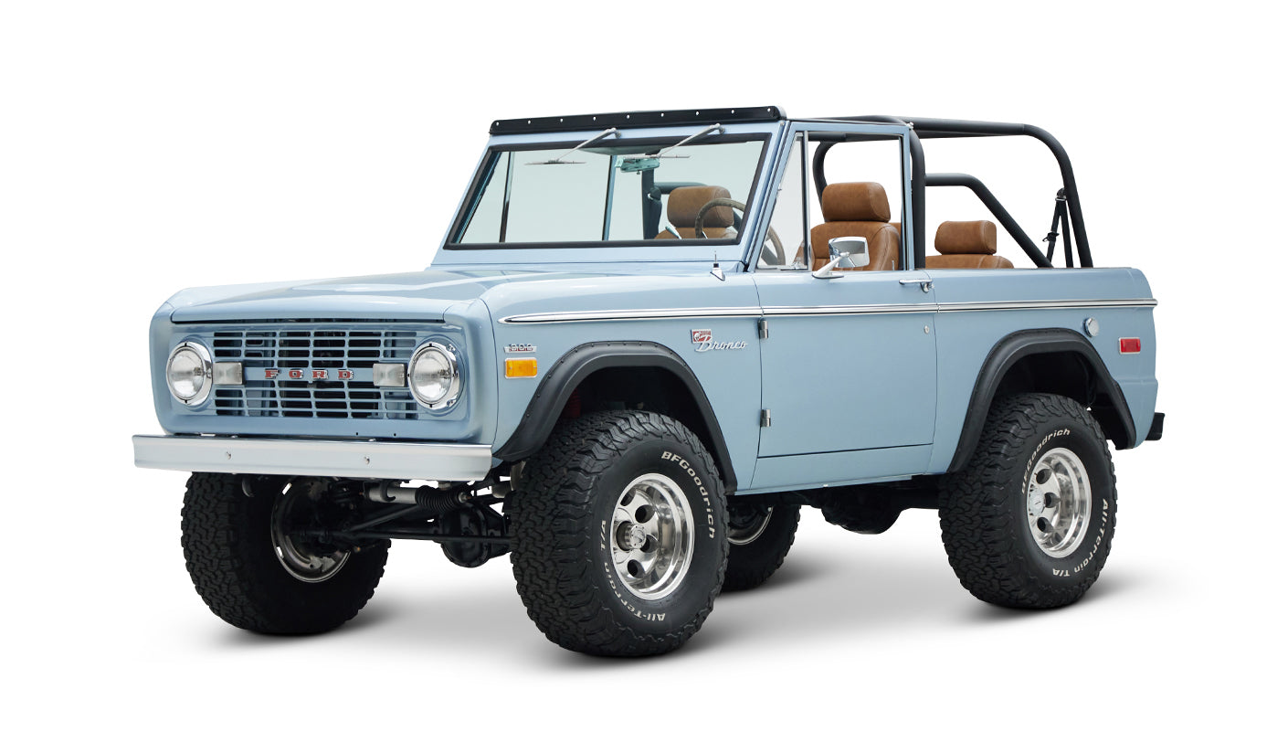 Classic Ford Bronco in Brittany Blue, three-quarter front view with lifted suspension