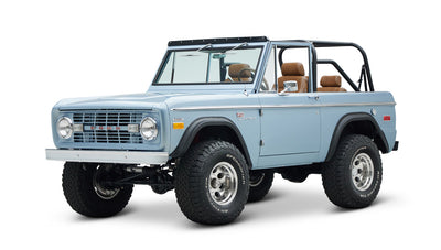Classic Ford Bronco in Brittany Blue, three-quarter front view with lifted suspension