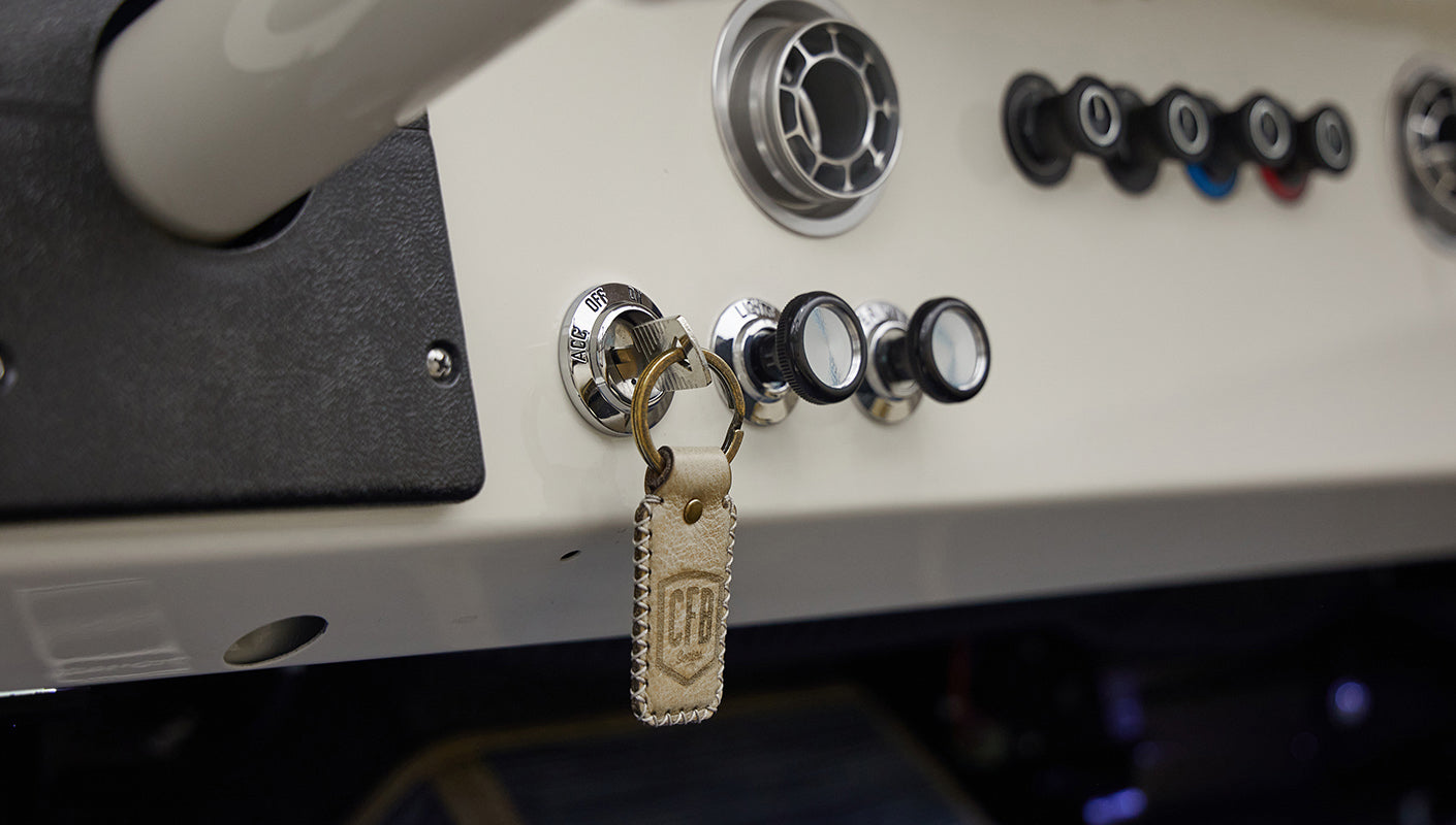 A 1976 Classic Ford Bronco is Frozen Blue over White Rock leather key