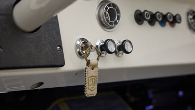 A 1976 Classic Ford Bronco is Frozen Blue over White Rock leather key