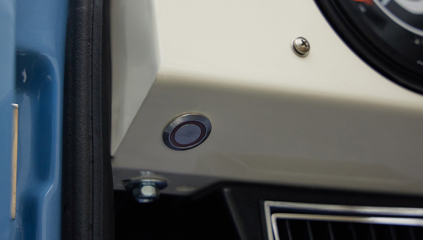 A 1976 Classic Ford Bronco is Frozen Blue over White Rock leather electronic parking brake