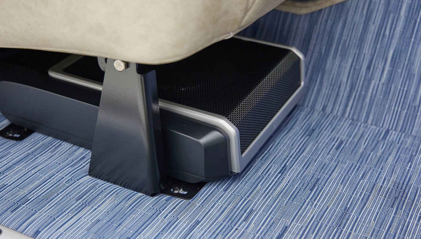 A 1976 Classic Ford Bronco is Frozen Blue over White Rock leather subwoofer
