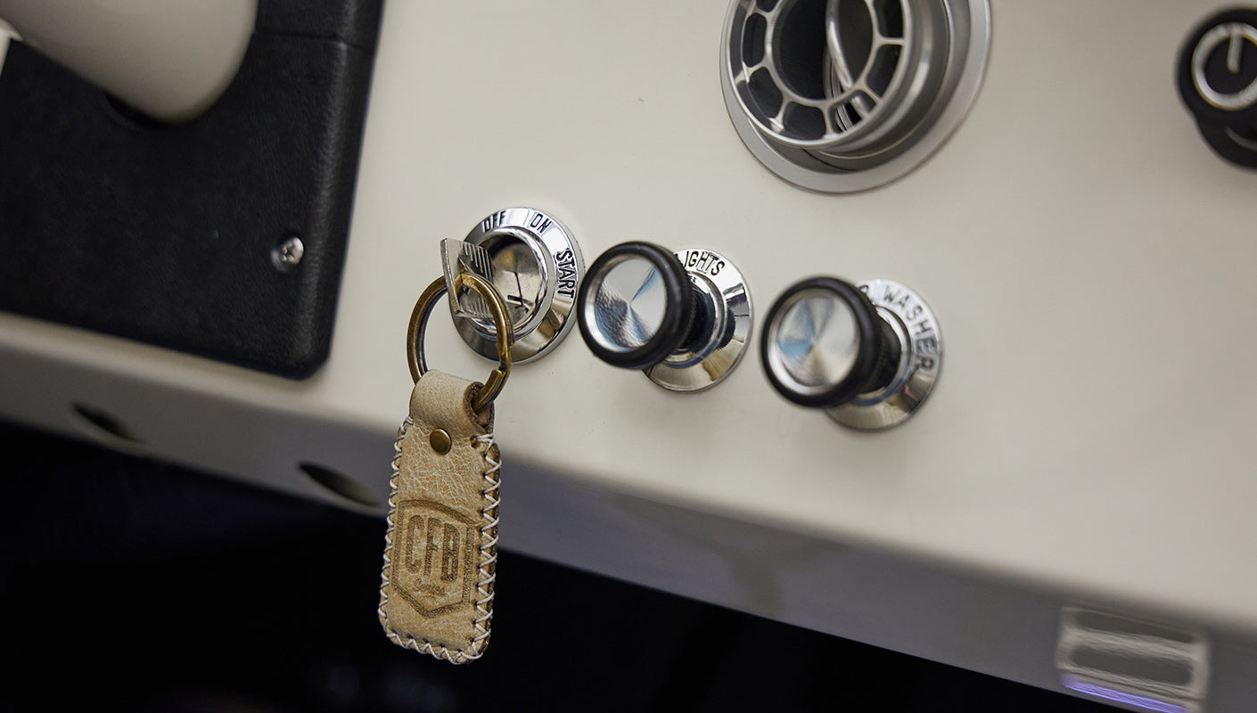A 1976 Classic Ford Bronco is Frozen Blue over White Rock leather dash