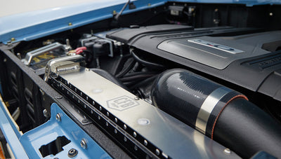 A 1976 Classic Ford Bronco is Frozen Blue over White Rock leather ford coyote motor