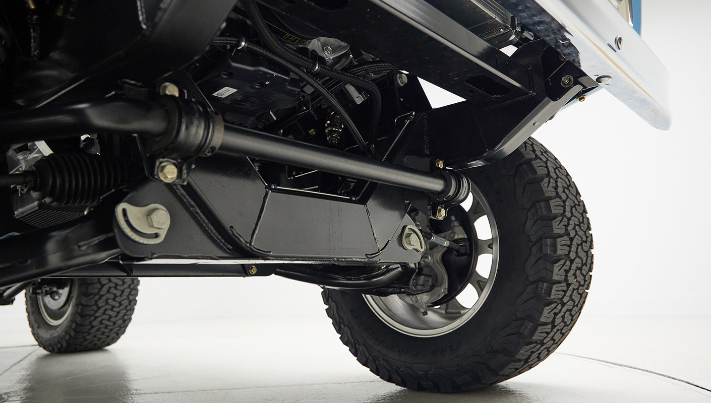 A 1976 Classic Ford Bronco is Frozen Blue over White Rock leather roadster shop chassis independent suspension
