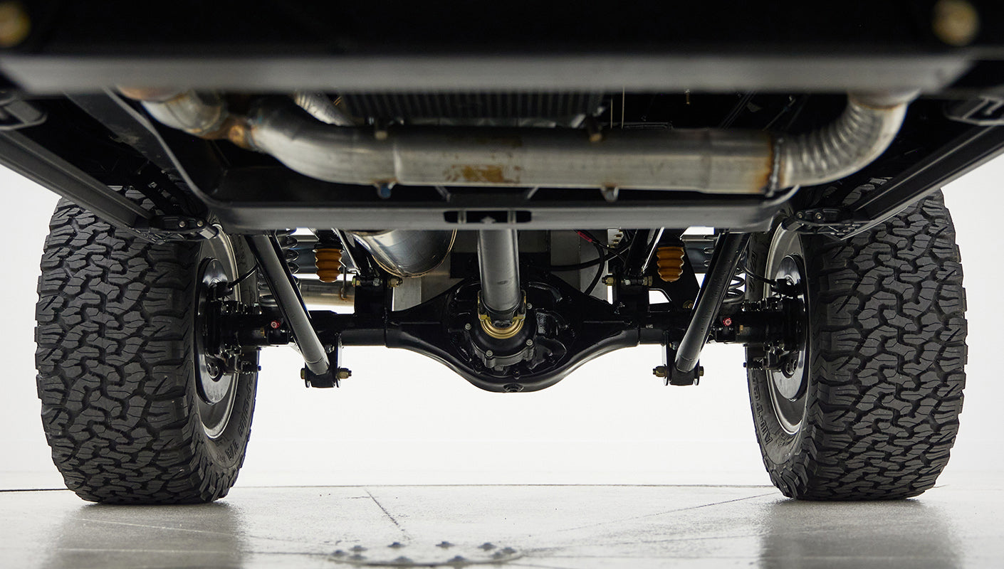 A 1976 Classic Ford Bronco is Frozen Blue over White Rock leather roadster shop chassis independent suspension