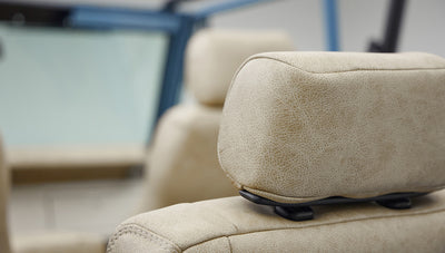 A 1976 Classic Ford Bronco is Frozen Blue over White Rock leather headrests