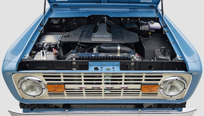 A 1976 Classic Ford Bronco is Frozen Blue over White Rock leather ford coyote motor