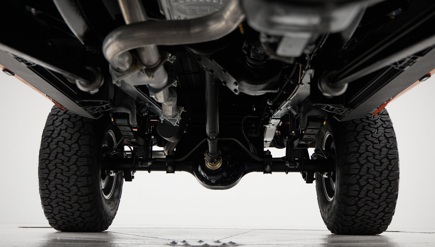 Underside of Classic Ford Bronco showing suspension and drivetrain details