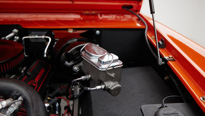 Close-up view of brake master cylinder and engine components in Classic Ford Bronco