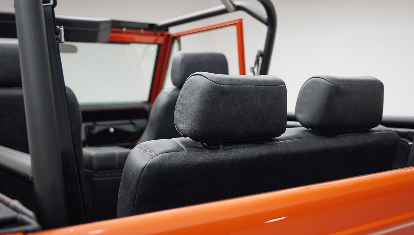 Black leather headrests on front seats inside open-top Classic Ford Bronco