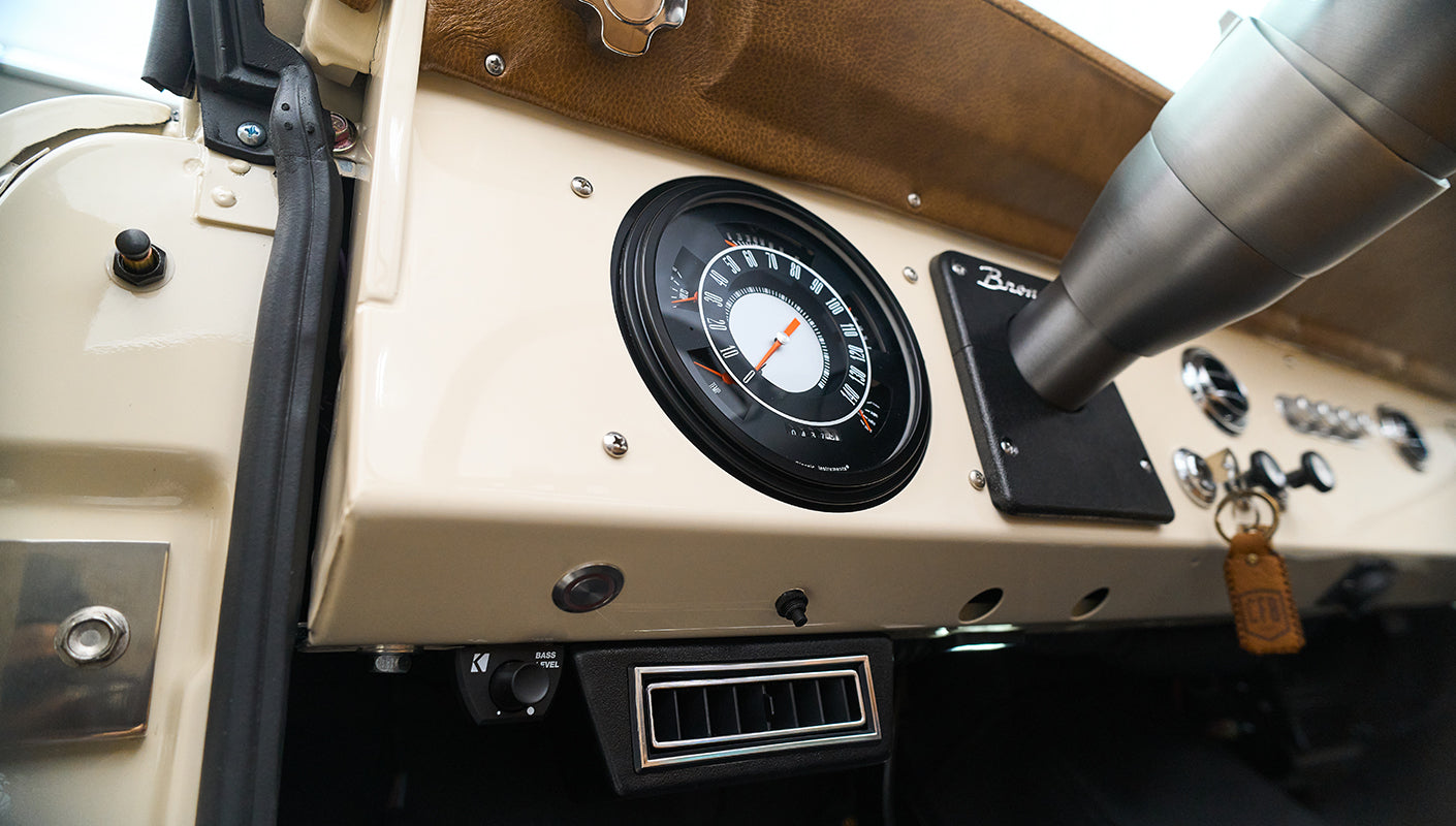 Classic Ford Bronco dashboard with speedometer and vintage controls