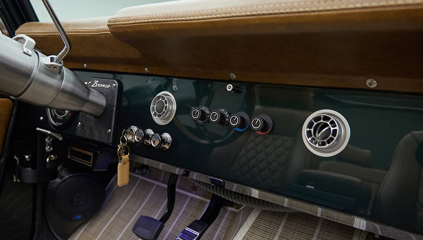 1966 ford bronco in highland green with whiskey leather interior dash detail