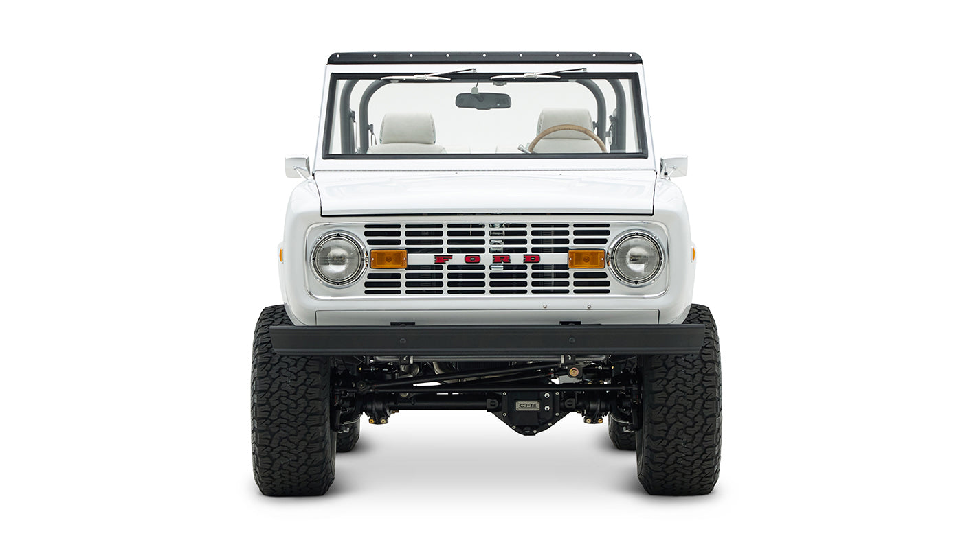 Front view of Classic Ford Bronco showing grille, headlights, and visible suspension