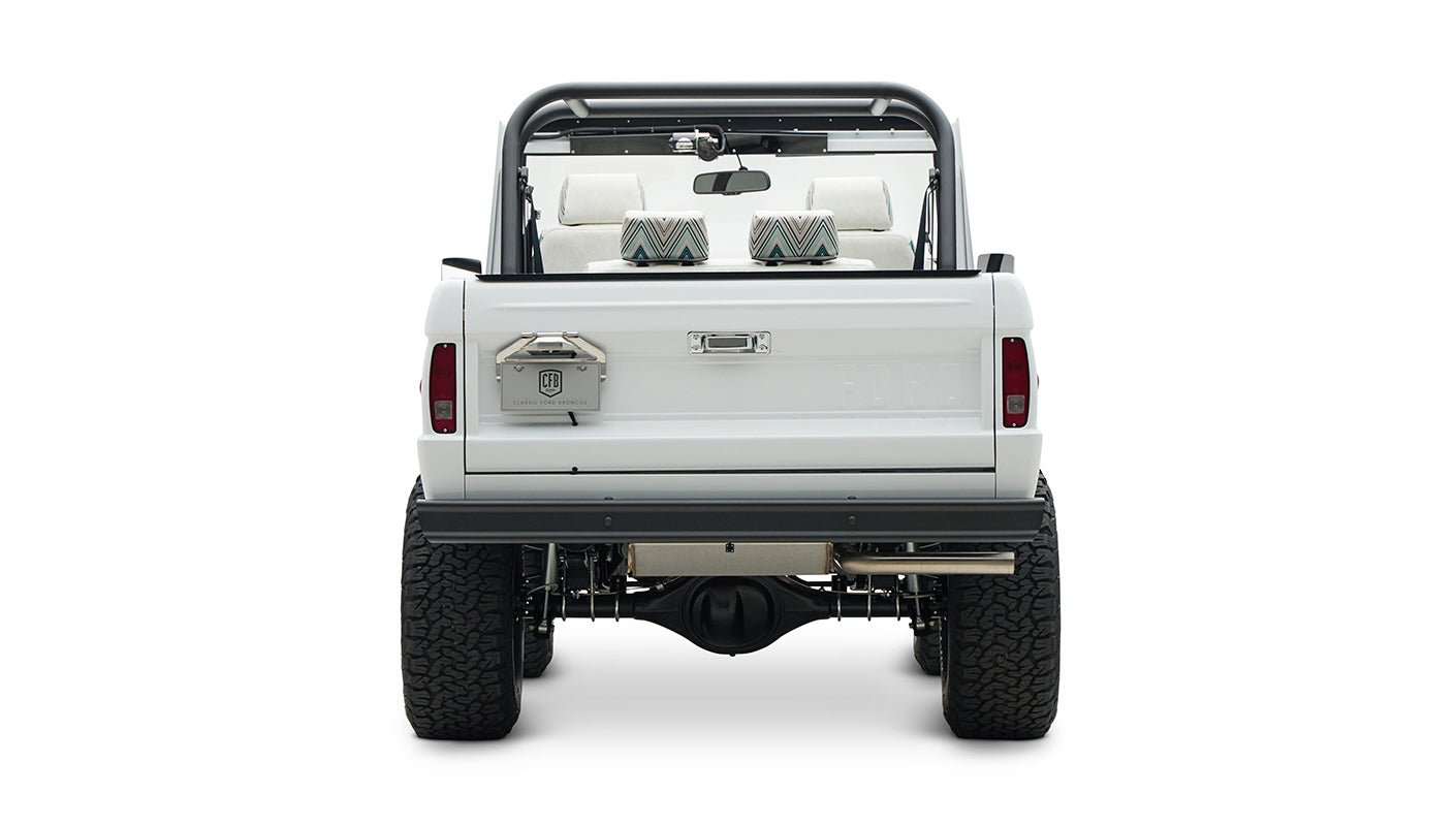 Rear view of Classic Ford Bronco showing tailgate, roll cage, and dual rear wheels