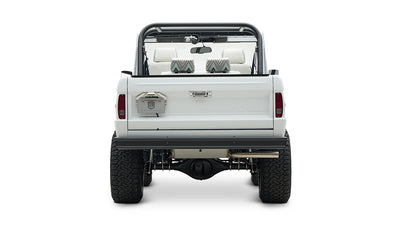 Rear view of Classic Ford Bronco showing tailgate, roll cage, and dual rear wheels