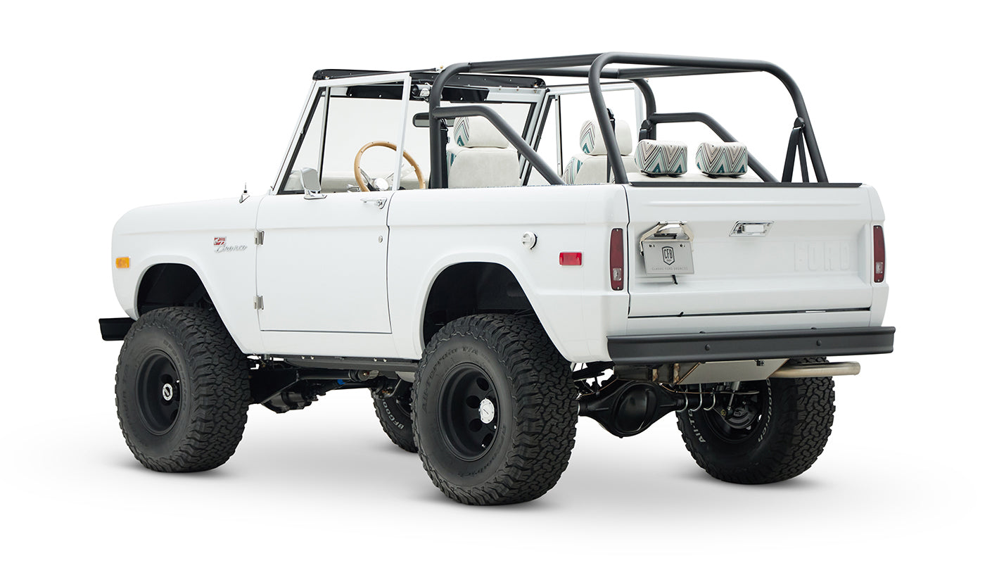 Classic Ford Bronco 1966 white open-top vehicle seen from rear-side angle