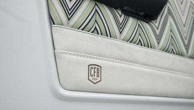 Classic Ford Bronco 1966 White Coyote Series front driver side with white and patterned interior door panel
