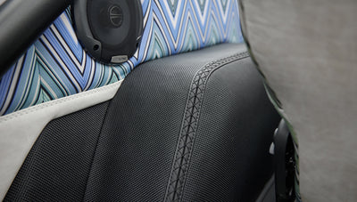 Classic Ford Bronco 1966 White Coyote Series close-up of patterned and black seat upholstery with Alpine speaker