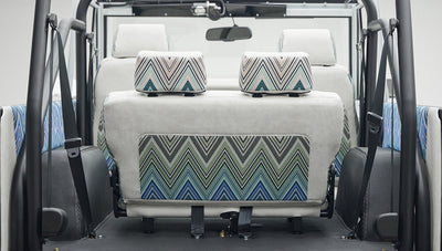 Classic Ford Bronco 1966 White Coyote Series rear seats with patterned and white upholstery and safety belts