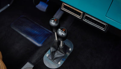 Two black gear shift levers with shift pattern detailing inside Classic Ford Bronco