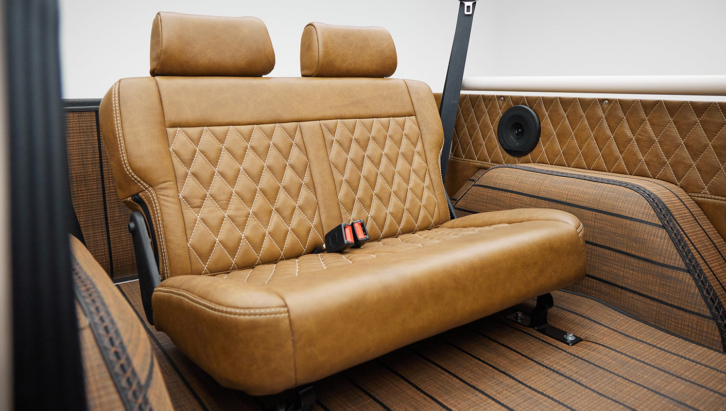 Rear bench seat with seat belts and side panels with speakers inside Classic Ford Bronco