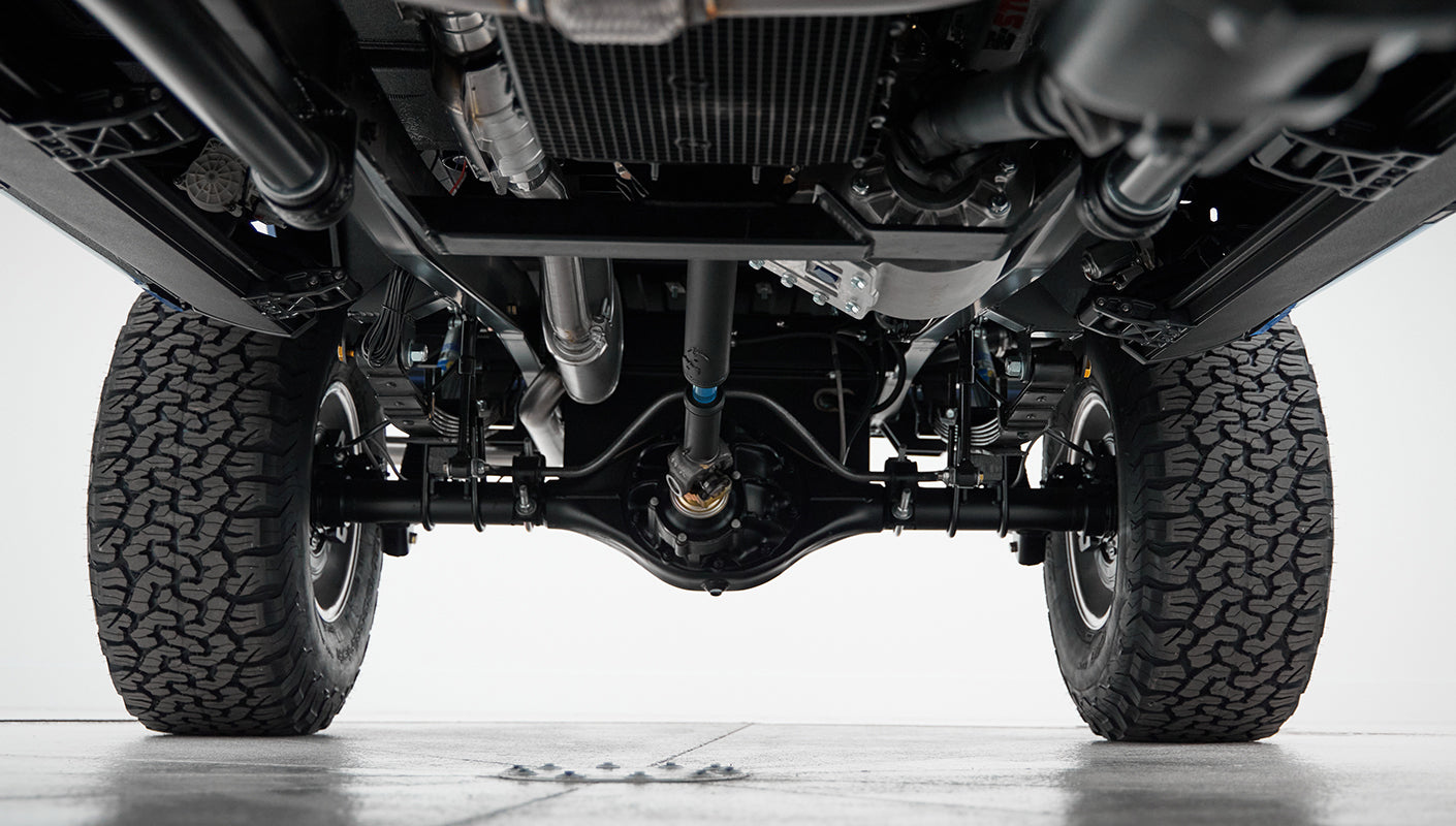 Complete underside view of Classic Ford Bronco showing axles and tires