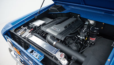 Close-up angle of Classic Ford Bronco's engine bay and radiator