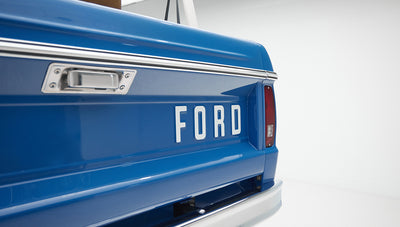 Dashboard and instrument cluster inside Classic Ford Bronco showing speedometer and controls