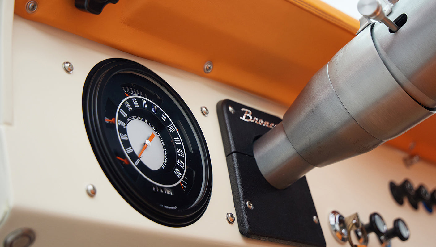 1973 Classic Ford Bronco in frozen blue with rolls royce orange leather and alpaca interior gauge