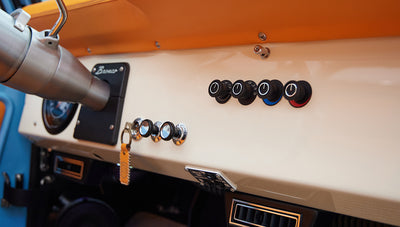1973 Classic Ford Bronco in frozen blue with rolls royce orange leather and alpaca interior dash