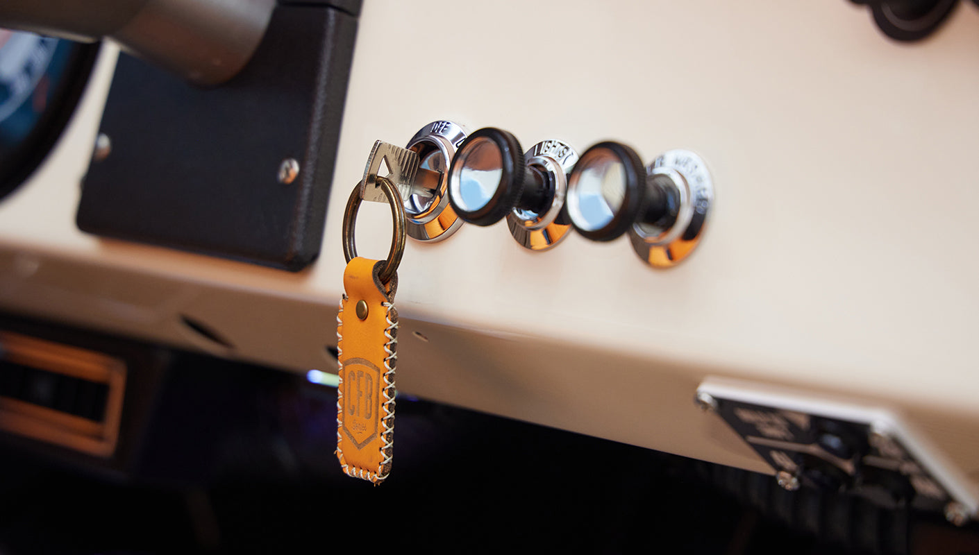 Close-up of Classic Ford Bronco dashboard with key and leather keychain